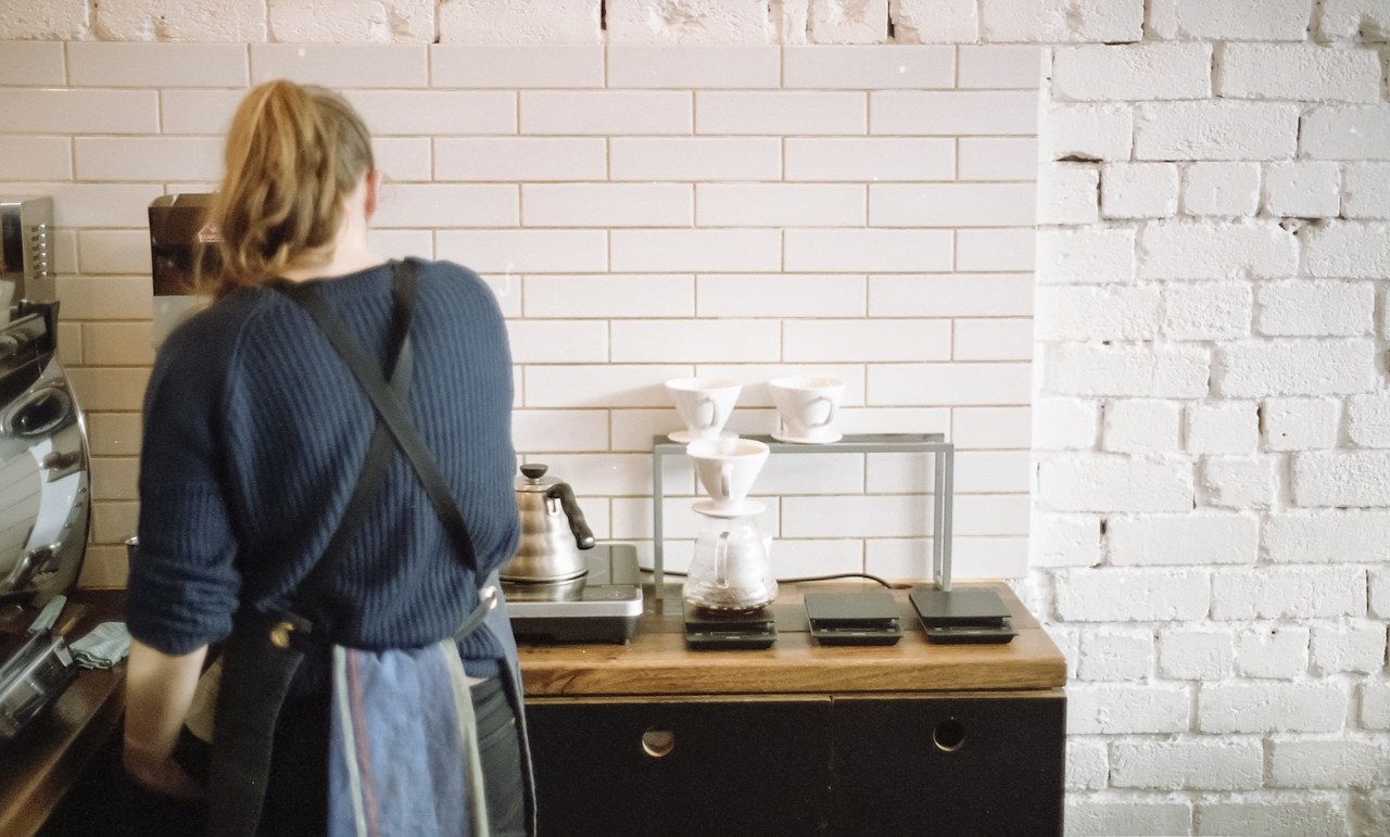 Barista brewing filter coffee